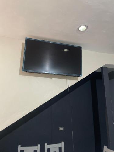 a flat screen tv on top of a wall at Casa Tequila Club in Arandas