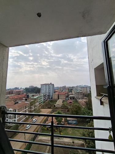 a view of a city from a balcony at Luxe Studio Kinoo in Rungiri