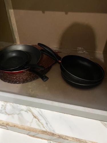 two frying pans sitting on top of a stove at Casa Tequila Club in Arandas