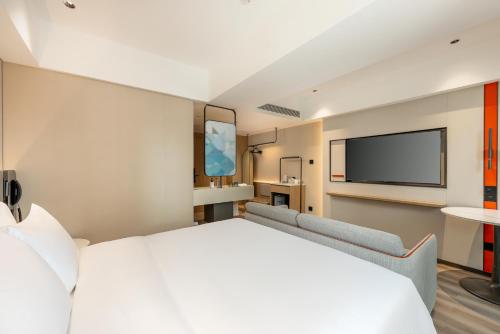 Postel nebo postele na pokoji v ubytování Holiday Inn Express Guiyang Downtown by IHG