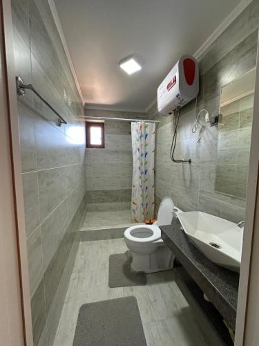 a bathroom with a toilet and a sink and a shower at Кыргызское Взморье Иссык-Куль, Issyk - Kul, Bosteri, Kyrgyz vzmorie in Bosteri
