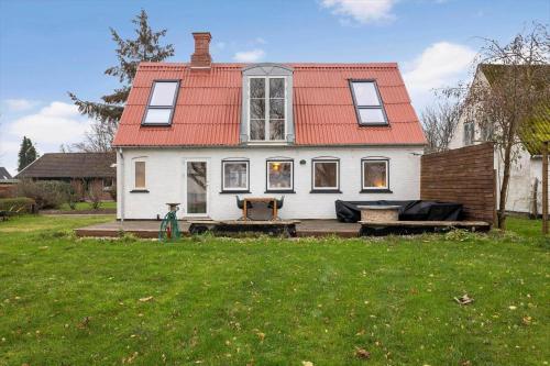 a large white house with an orange roof at AE202-Marstal-Baggarde-8 in Marstal