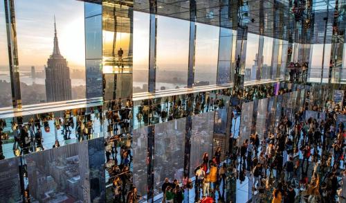 a view of the empire state building from the top of a skyscraper at Nice 3BR Apt | 3 Beds |15 Min to NYC/Manhattan! in North Bergen