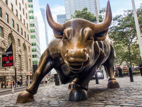 a statue of a bull on a city street at Nice 3BR Apt | 3 Beds |15 Min to NYC/Manhattan! in North Bergen