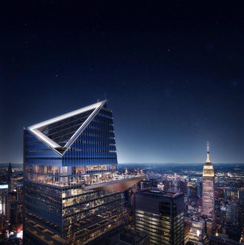 a view of a tall building in a city at night at Nice 3BR Apt | 3 Beds |15 Min to NYC/Manhattan! in North Bergen
