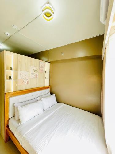 Ένα ή περισσότερα κρεβάτια σε δωμάτιο στο SMDC Style Residences Studios