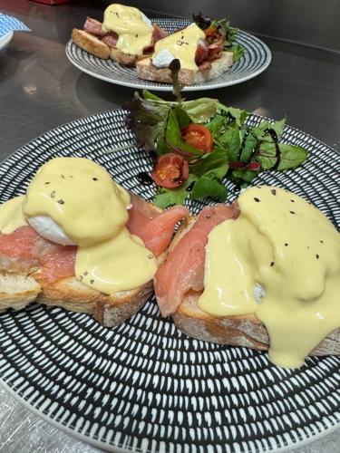 two plates of food with bread with meat and cheese at Spinifex Hotel in Derby