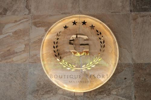 a bronze medal on the side of a wall at The French Villa-Santander Cebu in Santander