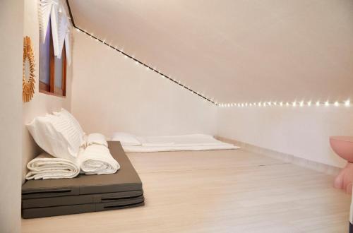 a room with a bed and lights on the wall at Seokchon Lake Memories Stay in Seoul