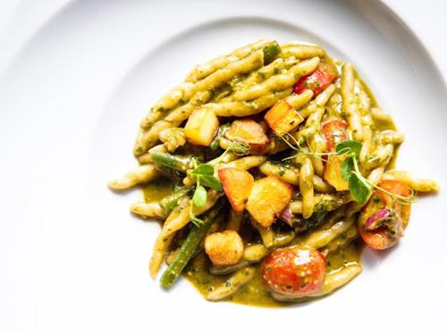 a plate of pasta with potatoes and other vegetables at Hotel Villa Medici in Bad Schonborn
