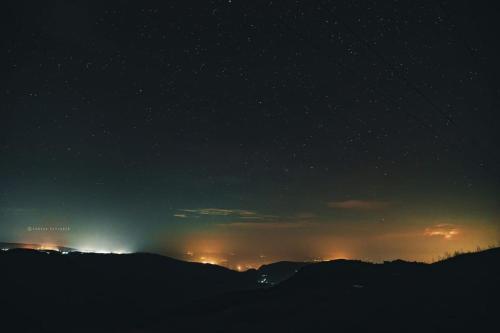 a night time view of fires in the distance at Sunset inlet homestay Cherrapunjee in Shillong