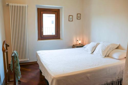 Ένα ή περισσότερα κρεβάτια σε δωμάτιο στο Casa dël canton