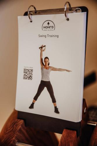 a poster of a man performing a yoga pose at Hotel Villa Medici in Bad Schonborn