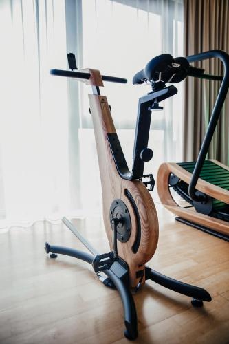 two exercise bikes sitting on the floor in a room at Hotel Villa Medici in Bad Schonborn