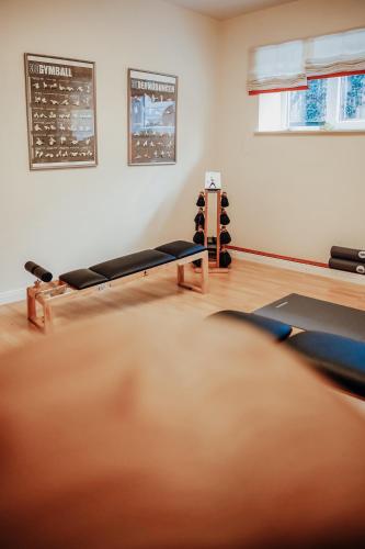 a room with a gym with rows of pilates equipment at Hotel Villa Medici in Bad Schonborn