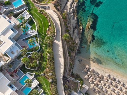 an aerial view of the beach and the ocean at Mykonos Blu, A Grecotel Resort to Live in Psarou