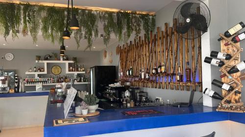 a bar with a blue counter in a room at Golden Coast Suites in Kipseli