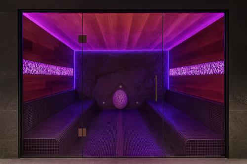 a purple room with a purple floor and stairs at Wood Hotel Resort & SPA in Bukovel