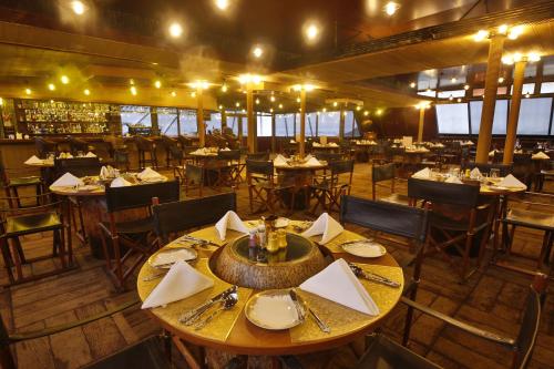 an overhead view of a restaurant with tables and chairs at Vintage Luxury Yacht Hotel in Yangon