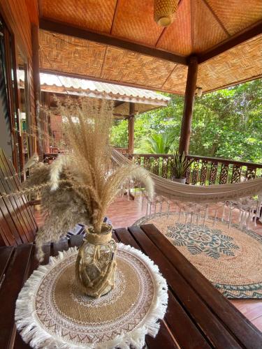 a vase with plants in it on a porch at Baan Kiao in Haad Yao