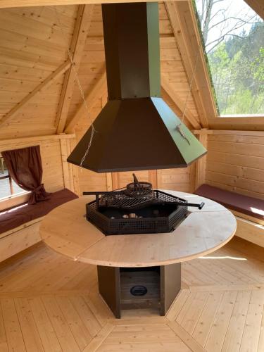 a lamp hanging over a table in a room at Apartmán u Ondrucha in Velké Karlovice