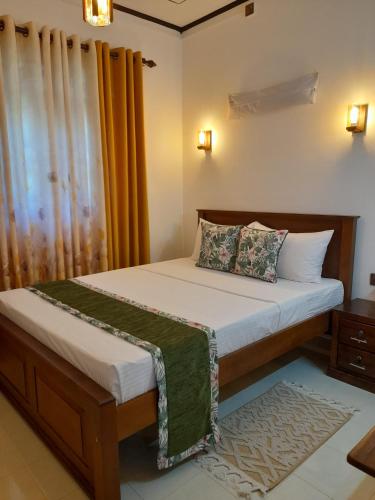 a small bedroom with a bed with at Eco Touch Dickwella in Batigama