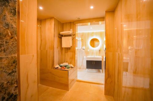 a bathroom with a shower and a walk in shower at Düzce Derdin Termal Resort & Spa in Duzce