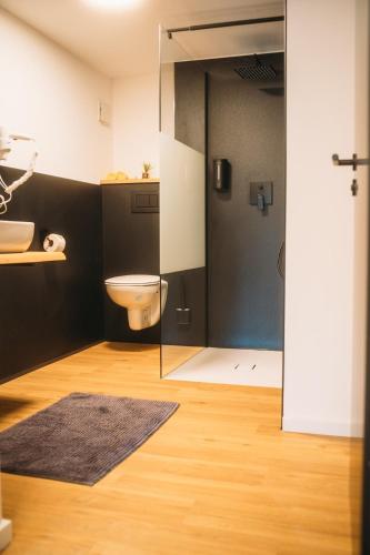 a bathroom with a toilet and a sink at Ferienhaus Schöne Aussicht Schwarz in Edertal