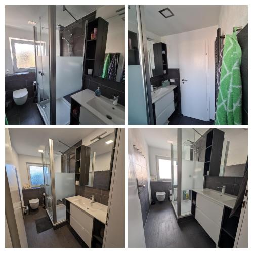 a bathroom with two sinks and a large mirror at Ferienwohnung Familie Perl in Immenhausen