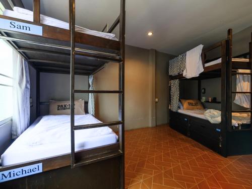 a room with two bunk beds in a hostel at Pak-Up Hostel in Krabi town