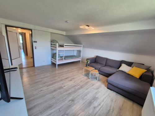 a living room with a couch and a bed at Silva2 in Kappel-Grafenhausen