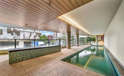 an indoor swimming pool in a house at 2BR Apt in Proximity Hamilton with Carpark in Brisbane