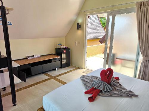 Ένα ή περισσότερα κρεβάτια σε δωμάτιο στο Blue Haven Bay Villa 21C