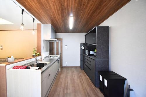 a kitchen with a sink and a counter top at 瀬の宿 in Takamatsu