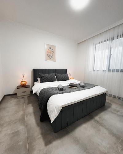 Katil atau katil-katil dalam bilik di INhouse Villa İsmayıllı
