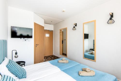 Ένα ή περισσότερα κρεβάτια σε δωμάτιο στο Sapphire Hotel Room Poznan