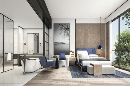 a bedroom with a bed and a desk at Sheraton Kunshan Dianshan Lake in Kunshan
