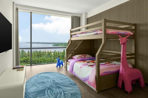 a bedroom with a bunk bed with a giraffe at Sheraton Kunshan Dianshan Lake in Kunshan