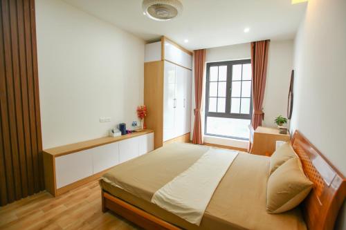 Mango Riverside Hotel & Apartment - Hai Phongにあるベッド