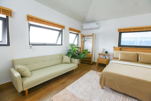 Mango Riverside Hotel & Apartment - Hai Phongにあるベッド
