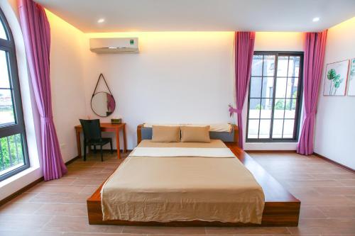 Mango Riverside Hotel & Apartment - Hai Phongにあるベッド