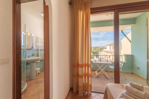 a room with a view of a bathroom with a balcony at Residence Galatea -Monolocale in Palau
