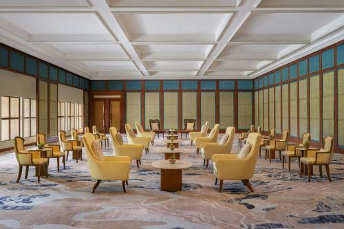 a large room with chairs and tables and windows at The Westin Resort Nusa Dua, Bali in Nusa Dua