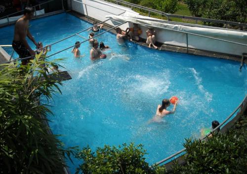 a group of people in a swimming pool at Romantik-Pension Vogt in Offenburg