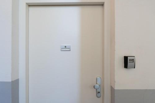 a door with a lock and a box on it at FarawayHomes Studios Klosterneuburg in Klosterneuburg