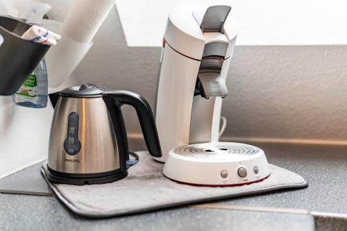 a coffee maker sitting on a kitchen counter at Haus Ursula in Ettenheim