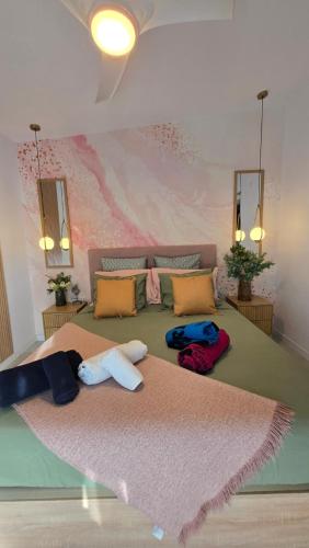 a bedroom with a large bed with towels on it at New! Sea View Apartment with Aircon in Center of Las Americas in Playa de las Americas