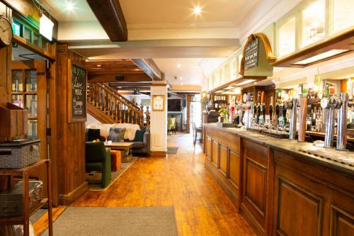 a bar in a pub with a lot of alcohol at The Albert in Bowness-on-Windermere