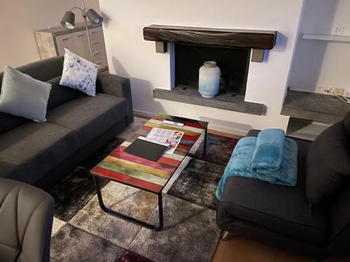 a living room with a couch and a table at Casa Aviva in Muralto
