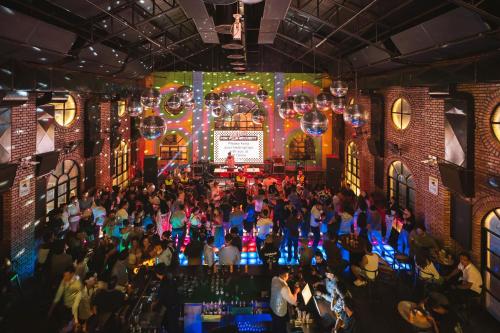 an overhead view of a crowd of people at a nightclub at Gaas BaasCo in Kathmandu
